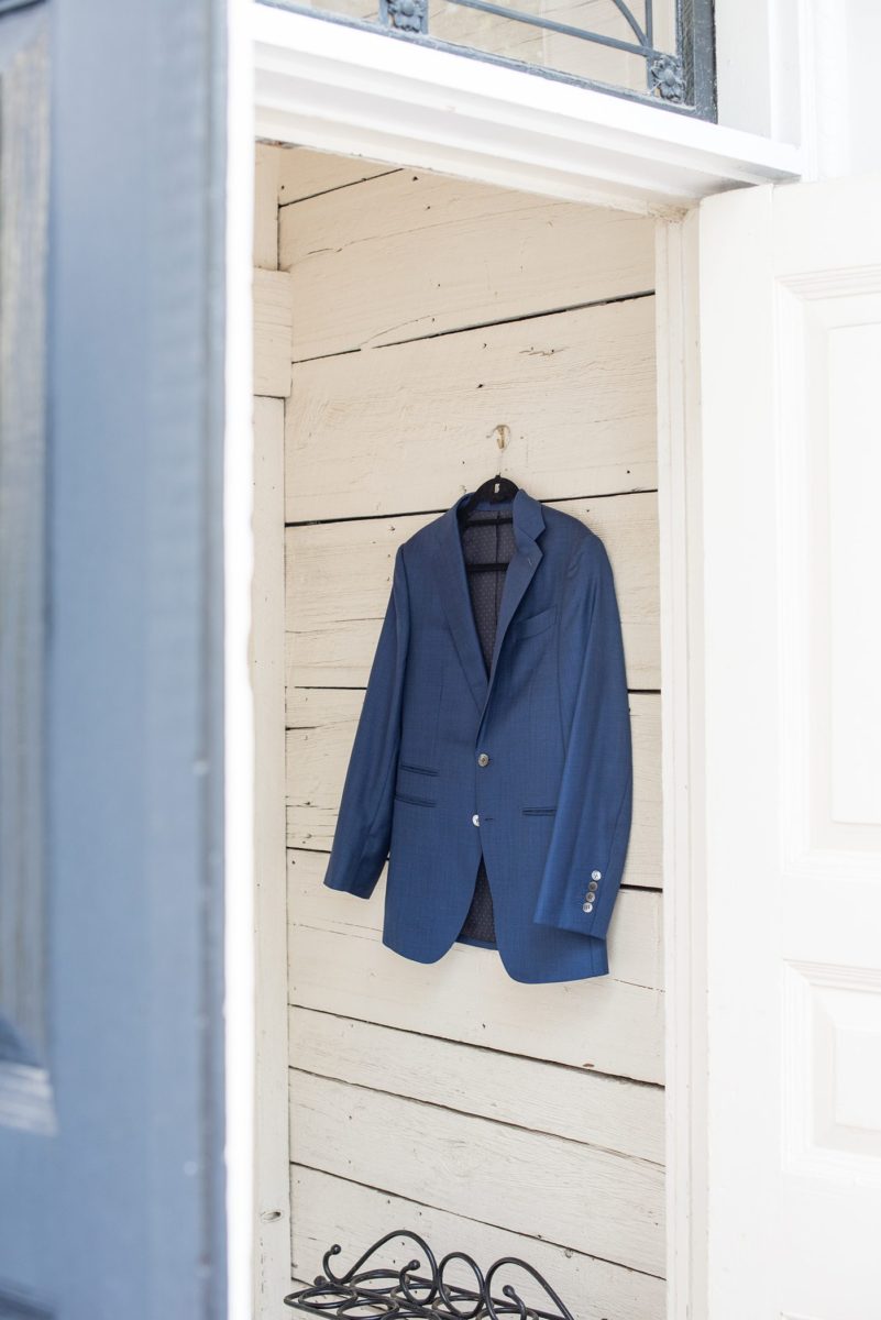 The groom wore a custom blue suit with his signature embroidered in red thread inside and custom initials on the cuffs for his wedding at Crabtree's Kittle House in Chappaqua, New York. Photos by Mikkel Paige Photography. This venue in Westchester County is near the Hudson Valley and NYC. #mikkelpaige #hudsonvalleyweddings #crabtreeskittlehouse #fallwedding #westchestervenues #groom #weddingday #groomstyle #customsuit