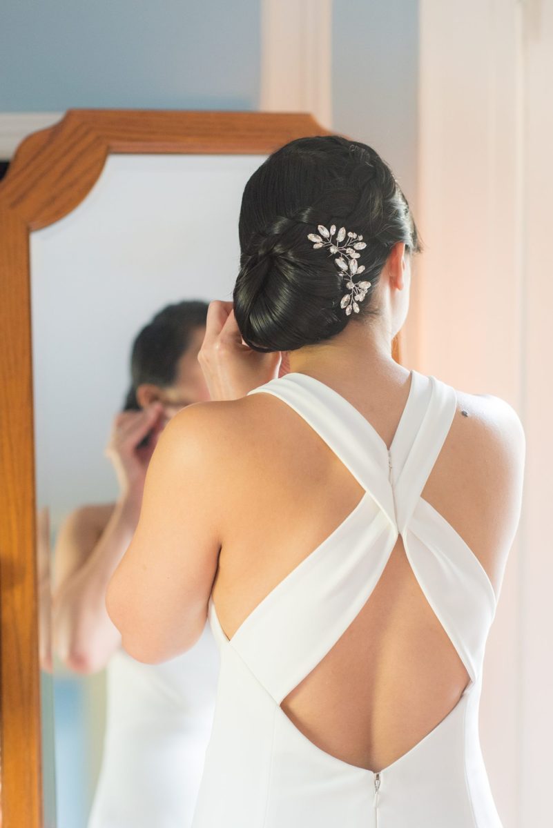 The bride and groom at their Crabtree's Kittle House wedding with an outdoor ceremony and indoor reception in Chappaqua, New York. Photos by Mikkel Paige Photography. This venue in Westchester County is near the Hudson Valley and NYC. She wore an elegant, form-fitting white gown with open back with her hair braided and in a low bun. #mikkelpaige #hudsonvalleyweddings #crabtreeskittlehouse #fallwedding #westchestervenues #bridestyle #elegantbride #filipinobride