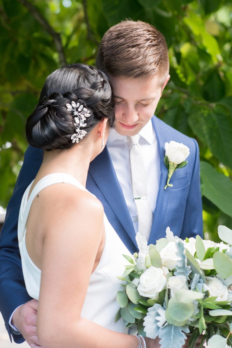 The bride and groom at their Crabtree's Kittle House wedding with an outdoor ceremony and indoor reception in Chappaqua, New York. Photos by Mikkel Paige Photography. This venue in Westchester County is near the Hudson Valley and NYC. She wore an elegant, form-fitting white gown with open back with her hair braided and in a low bun. #mikkelpaige #hudsonvalleyweddings #crabtreeskittlehouse #fallwedding #westchestervenues #bridestyle #elegantbride #filipinobride