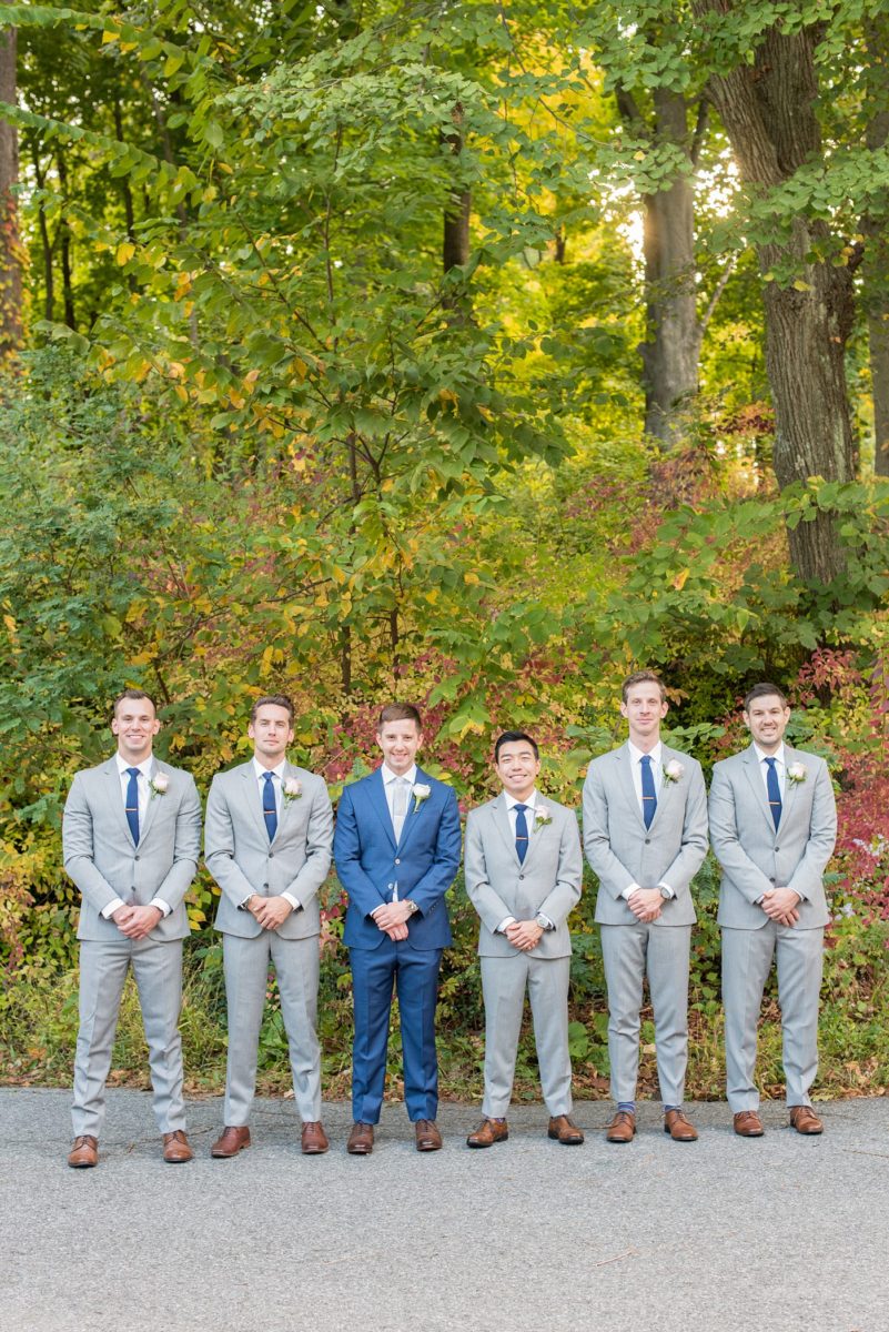 Crabtree's Kittle House wedding with an outdoor ceremony in Chappaqua, New York. Photos by Mikkel Paige Photography. This venue in Westchester County is near the Hudson Valley and NYC. The groom wore a blue suit and groomsmen gray. They had simple rose boutonnieres. #mikkelpaige #hudsonvalleyweddings #crabtreeskittlehouse #fallwedding #westchestervenues #groomstyle #bluesuit