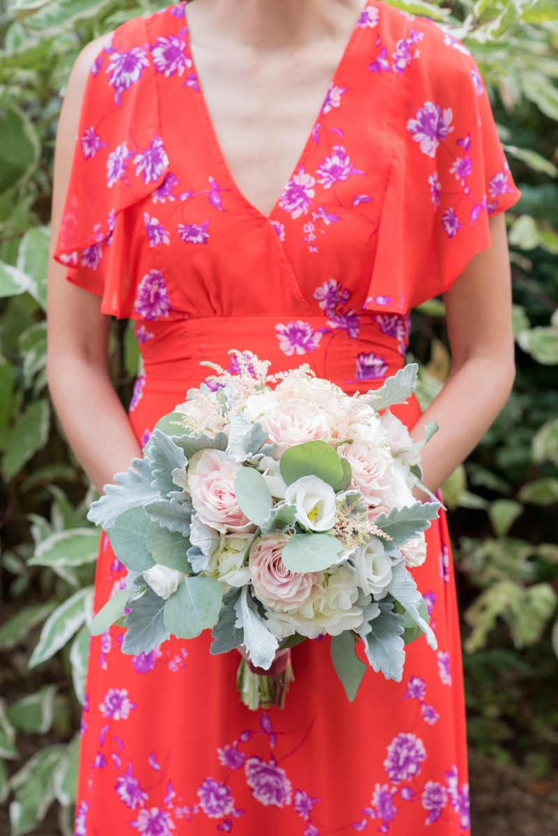 Crabtree's Kittle House wedding with an outdoor ceremony in Chappaqua, New York. Photos by Mikkel Paige Photography. This venue in Westchester County is near the Hudson Valley and NYC. The bride wore a simple form-fitted white gown with open back and bridesmaids wore red in Asian tradition. #mikkelpaige #hudsonvalleyweddings #crabtreeskittlehouse #fallwedding #westchestervenues #redbridesmaids #filipinowedding #bridestyle