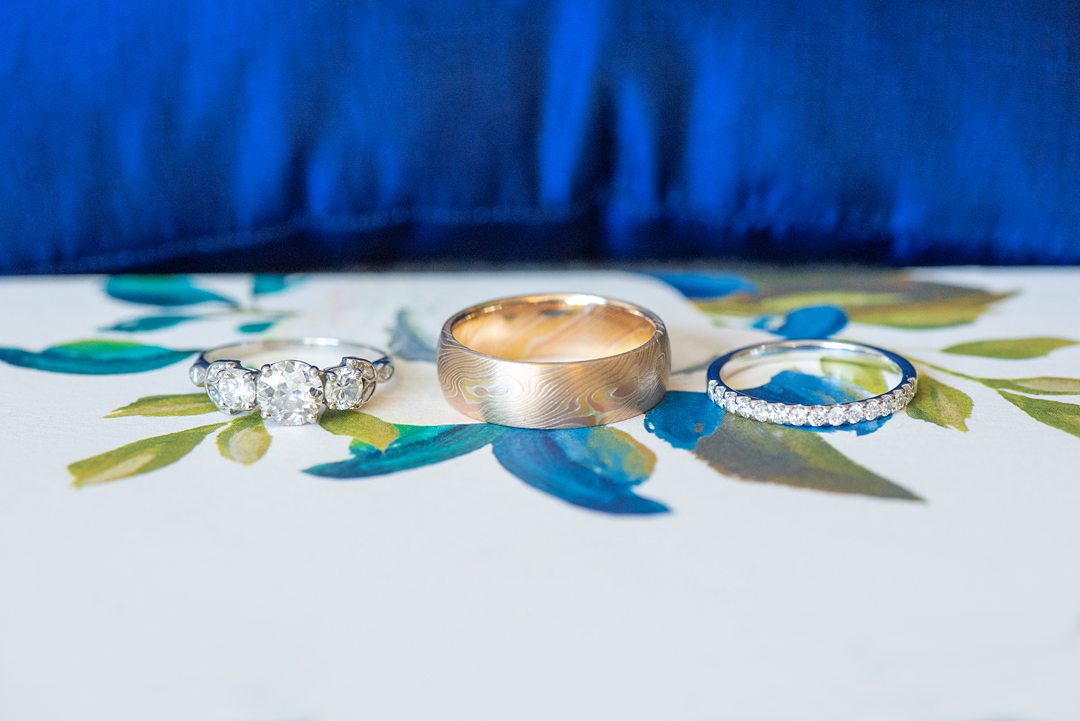 New Jersey wedding venue, Crystal Springs Resort, in Hamburg with an outdoor ceremony option and indoor reception. This detail photo of their rings, diamonds included, is by Mikkel Paige Photography. #mikkelpaige #CrystalSprings #NJweddingvenues #NewJerseyWedding #NJweddingphotographer #weddingrings #detailshots #detailphotos