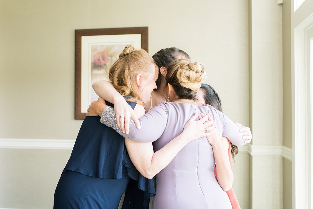 New Jersey wedding venue, Crystal Springs Resort, in Hamburg with an outdoor ceremony option and indoor reception. This pictures is of the bride's best friends and family helping her get ready for the day. Photos by Mikkel Paige Photography. #mikkelpaige #CrystalSprings #NJweddingvenues #NewJerseyWedding #NJweddingphotographer #gettingready 