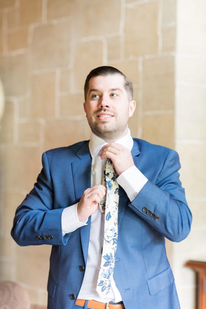 Photos at New Jersey wedding venue, Crystal Springs Resort, in Hamburg with an outdoor ceremony option and indoor reception, by Mikkel Paige Photography. The groom got ready for his day with his groomsmen and father-in-law and wore a blue suit and floral tie. #mikkelpaige #CrystalSprings #NJweddingvenues #NewJerseyWedding #NJweddingphotographer #bluesuit #groomstyle #gettingready