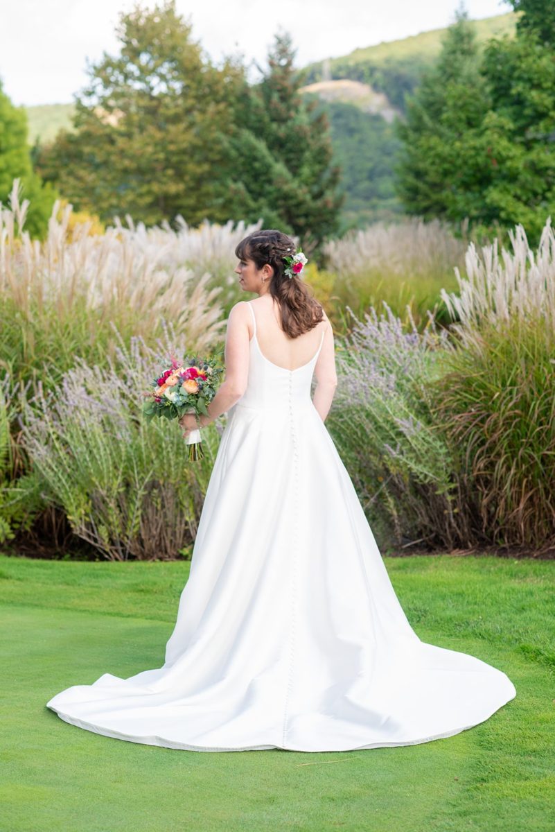 New Jersey wedding venue, Crystal Springs Resort, in Hamburg with an outdoor ceremony option and indoor reception. Photos by Mikkel Paige Photography. The bride wore a simple classic white dress with flowers in her hair. #mikkelpaige #CrystalSprings #NJweddingvenues #NewJerseyWedding #NJweddingphotographer #bridestyle