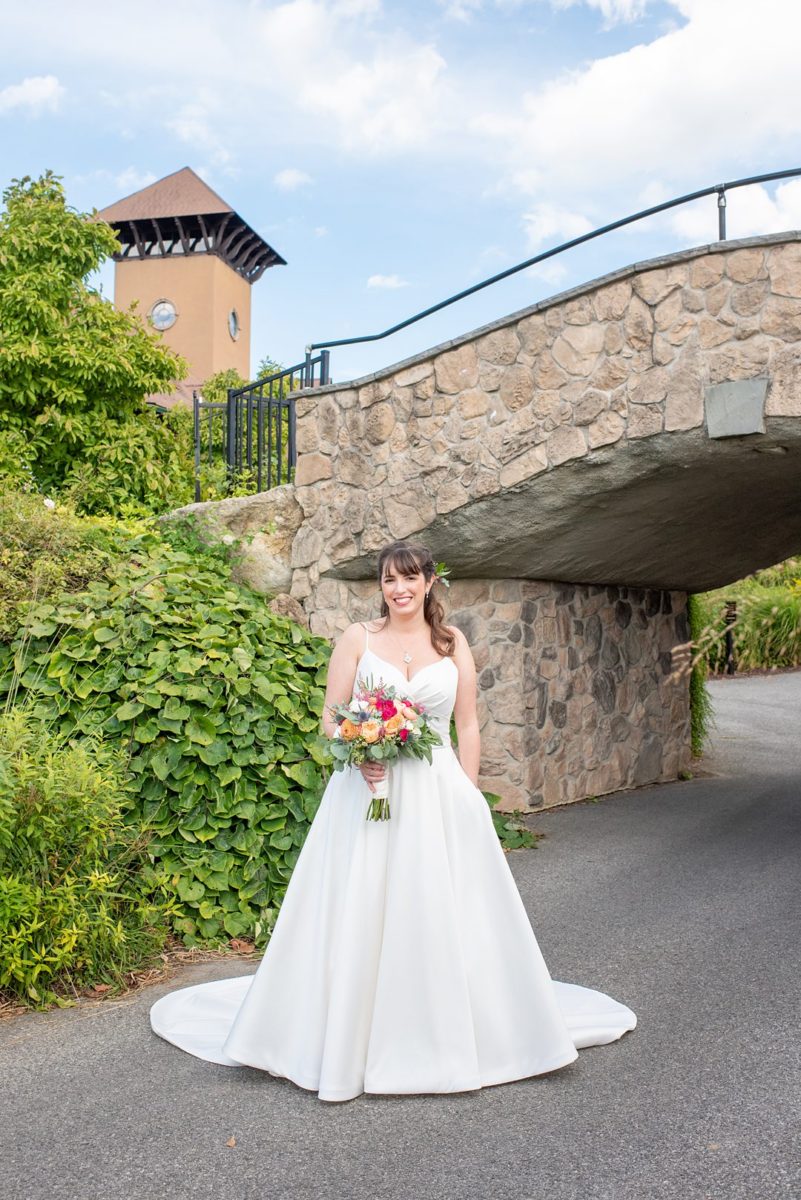 New Jersey wedding venue, Crystal Springs Resort, in Hamburg with an outdoor ceremony option and indoor reception. Photos by Mikkel Paige Photography. The bride wore a simple classic white dress with flowers in her hair. #mikkelpaige #CrystalSprings #NJweddingvenues #NewJerseyWedding #NJweddingphotographer #bridestyle