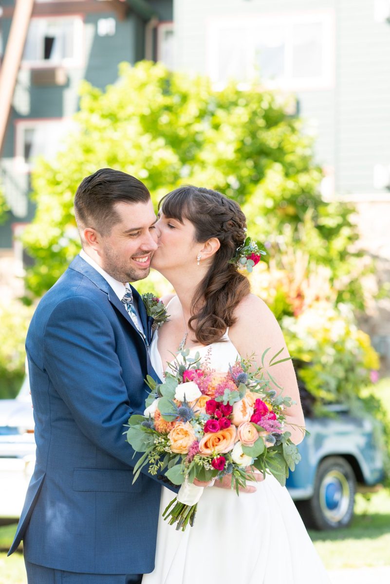 New Jersey wedding venue, Crystal Springs Resort, in Hamburg with an outdoor ceremony option and indoor reception. Photos by Mikkel Paige Photography. The bride wore a simple classic white dress with flowers in her hair and groom a blue suit and floral tie. #mikkelpaige #CrystalSprings #NJweddingvenues #NewJerseyWedding #NJweddingphotographer #brideandgroom