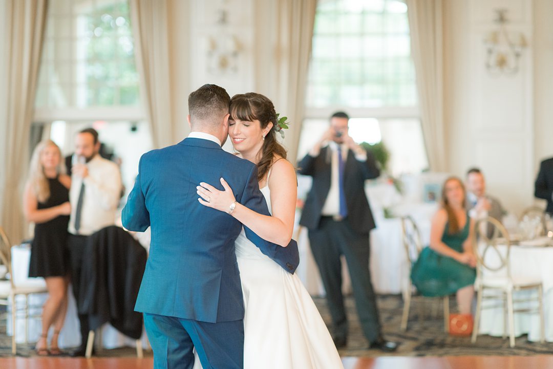 New Jersey wedding venue, Crystal Springs Resort, in Hamburg with an outdoor ceremony option and indoor reception. Photos by Mikkel Paige Photography. The bride wore a simple classic white dress with flowers in her hair and groom a blue suit and floral tie. #mikkelpaige #CrystalSprings #NJweddingvenues #NewJerseyWedding #NJweddingphotographer #brideandgroom