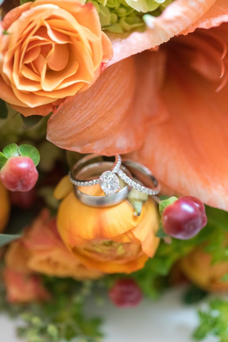 Fall wedding in upstate New York, just outside NYC, in Chappaqua, Westchester County. This bride and groom got married at Crabtree's Kittle House outdoors, then celebrated inside for their reception. It was filled with pumpkins, autumn leaves, orange, white, peach and navy colors. Detail photos taken by Mikkel Paige Photography of their white gold diamond rings. #mikkelpaige #fallwedding #newyorkweddingvenues #upstatenewyorkweddingvenues #nycweddingphotographer #ringshots #ringphotos