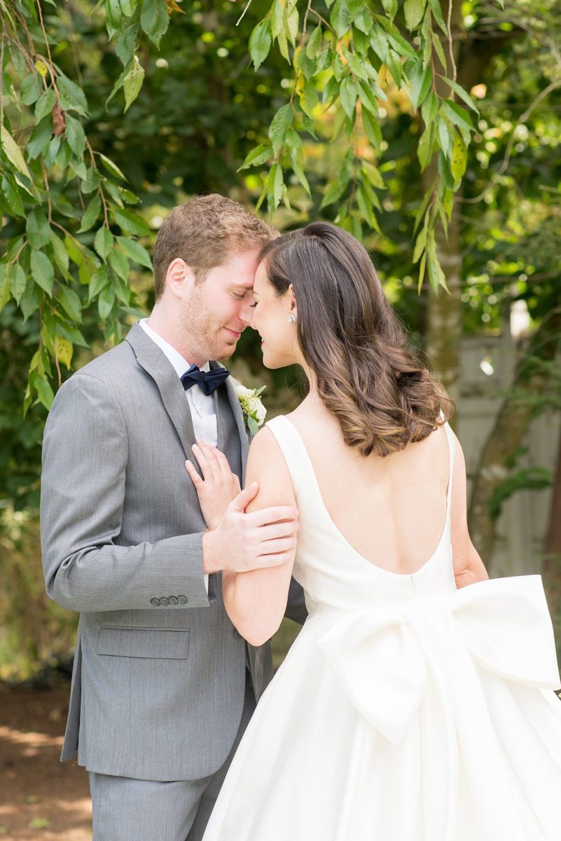 Photographs were taken by Mikkel Paige Photography for a fall wedding in upstate New York, just outside NYC, in Chappaqua, Westchester County. The bride and groom got married at Crabtree's Kittle House outdoors with an indoor reception. It was filled with pumpkins, autumn leaves, orange, white, peach and navy colors. The bride's gown had a long train and back bow. #mikkelpaige #fallwedding #newyorkweddingvenues #upstatenewyorkweddingvenues #nycweddingphotographer #BrideStyle #autumnbouquet