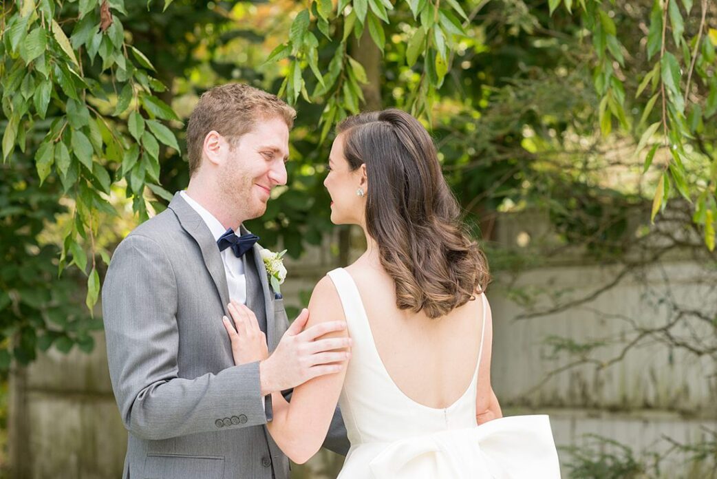 Photographs were taken by Mikkel Paige Photography for a fall wedding in upstate New York, just outside NYC, in Chappaqua, Westchester County. The bride and groom got married at Crabtree's Kittle House outdoors with an indoor reception. It was filled with pumpkins, autumn leaves, orange, white, peach and navy colors. The bride's gown had a long train and back bow. #mikkelpaige #fallwedding #newyorkweddingvenues #upstatenewyorkweddingvenues #nycweddingphotographer #BrideStyle #autumnbouquet