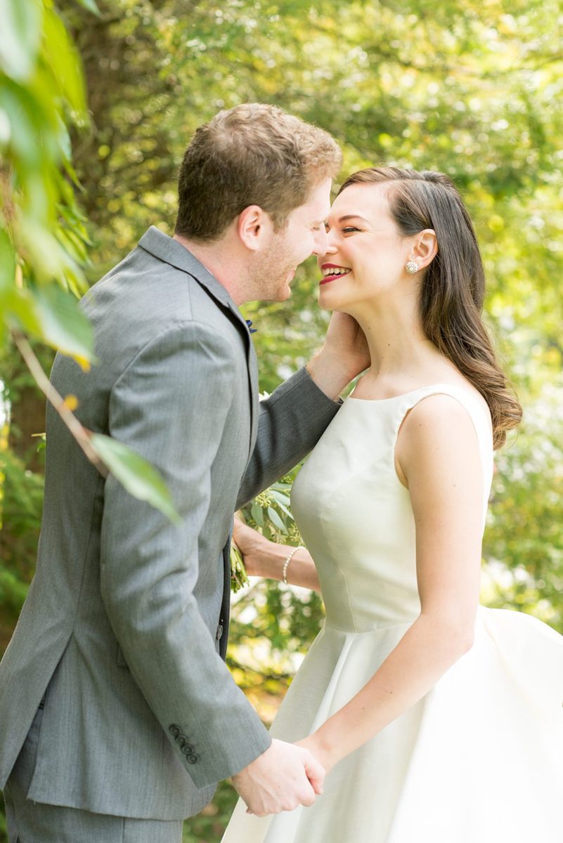 Photographs were taken by Mikkel Paige Photography for a fall wedding in upstate New York, just outside NYC, in Chappaqua, Westchester County. The bride and groom got married at Crabtree's Kittle House outdoors with an indoor reception. It was filled with pumpkins, autumn leaves, orange, white, peach and navy colors. The bride's gown had a long train and back bow. #mikkelpaige #fallwedding #newyorkweddingvenues #upstatenewyorkweddingvenues #nycweddingphotographer #BrideStyle #autumnbouquet