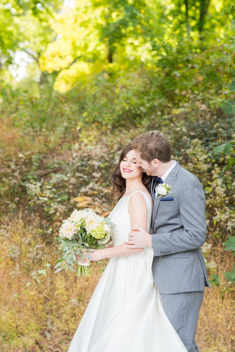 Photographs were taken by Mikkel Paige Photography for a fall wedding in upstate New York, just outside NYC, in Chappaqua, Westchester County. The bride and groom got married at Crabtree's Kittle House outdoors with an indoor reception. It was filled with pumpkins, autumn leaves, orange, white, peach and navy colors. The bride's gown had a long train and back bow. #mikkelpaige #fallwedding #newyorkweddingvenues #upstatenewyorkweddingvenues #nycweddingphotographer #BrideStyle #autumnbouquet