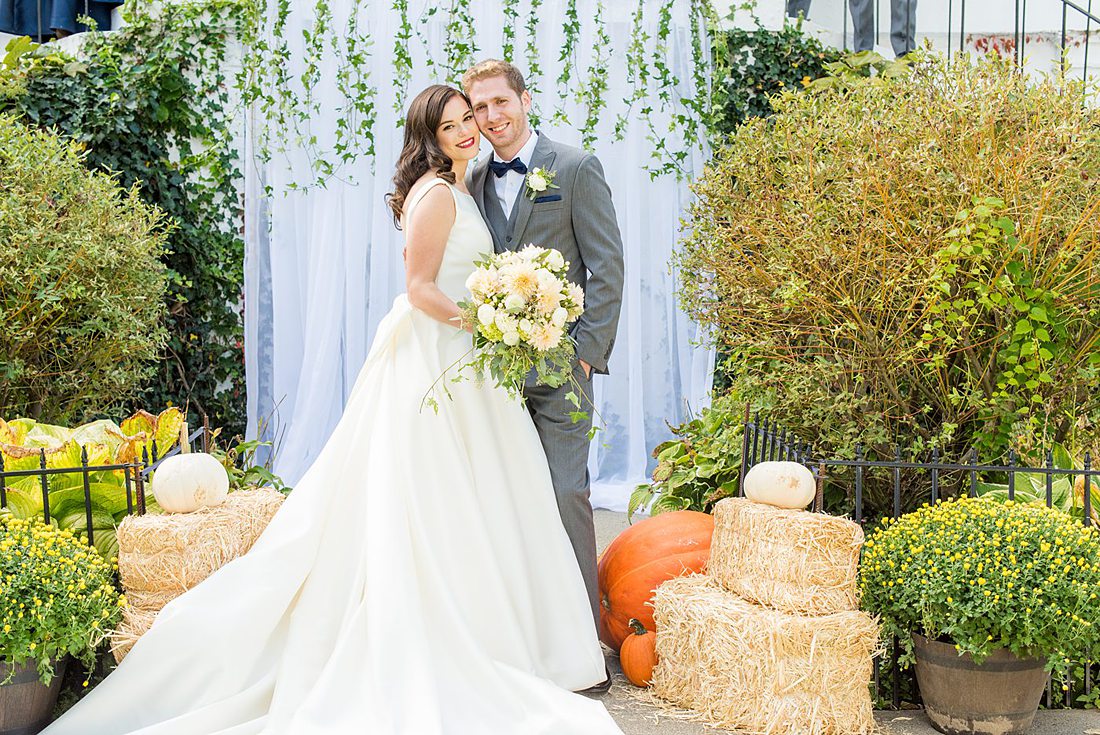 Fall wedding in upstate New York, just outside NYC, in Chappaqua, Westchester County. This bride and groom got married at Crabtree's Kittle House outdoors, then celebrated inside for their reception. It was filled with pumpkins, autumn leaves, orange, white, peach and navy colors. Photographs were taken by Mikkel Paige Photography. #mikkelpaige #fallwedding #newyorkweddingvenues #upstatenewyorkweddingvenues #nycweddingphotographer
