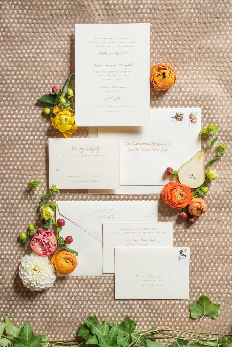 Fall wedding in upstate New York, just outside NYC, in Chappaqua, Westchester County. The wedding at Crabtree's Kittle House had an outdoor ceremony then reception indoors. It was filled with pumpkins, autumn leaves, orange, white, and peach colors. Detail invitation photo for the bride and groom taken by Mikkel Paige Photography. #mikkelpaige #fallwedding #newyorkweddingvenues #nycweddingphotographer #outdoorceremony #autumnwedding #weddinginvitation #weddingstationery
