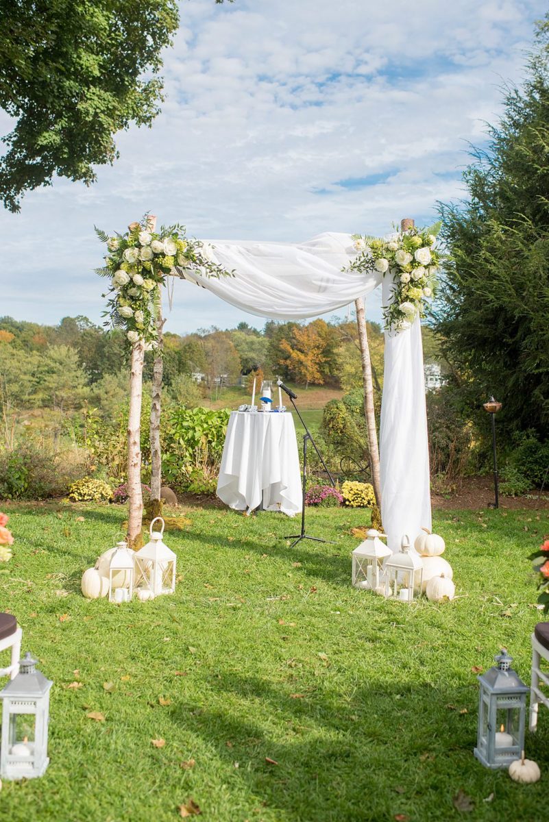 Fall wedding in upstate New York, just outside NYC, in Chappaqua, Westchester County. This bride and groom got married at Crabtree's Kittle House in an outdoor ceremony then celebrated inside for their reception. It was filled with pumpkins, autumn leaves, orange, white, peach and navy colors. Photos taken by Mikkel Paige Photography of their white gold diamond rings. #mikkelpaige #fallwedding #newyorkweddingvenues #upstatenewyorkweddingvenues #nycweddingphotographer #outdoorceremony