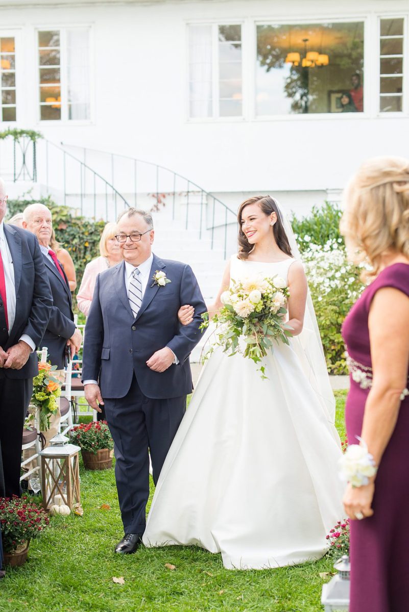 Fall wedding in upstate New York, just outside NYC, in Chappaqua, Westchester County. This bride and groom got married at Crabtree's Kittle House in an outdoor ceremony then celebrated inside for their reception. It was filled with pumpkins, autumn leaves, orange, white, peach and navy colors. Photos taken by Mikkel Paige Photography of their white gold diamond rings. #mikkelpaige #fallwedding #newyorkweddingvenues #upstatenewyorkweddingvenues #nycweddingphotographer #outdoorceremony