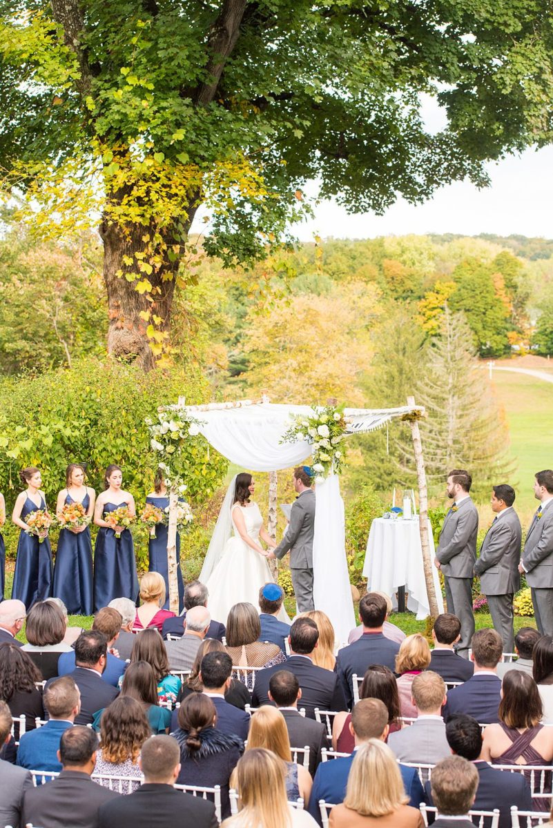 Fall wedding in upstate New York, just outside NYC, in Chappaqua, Westchester County. This bride and groom got married at Crabtree's Kittle House in an outdoor ceremony then celebrated inside for their reception. It was filled with pumpkins, autumn leaves, orange, white, peach and navy colors. Photos taken by Mikkel Paige Photography of their white gold diamond rings. #mikkelpaige #fallwedding #newyorkweddingvenues #upstatenewyorkweddingvenues #nycweddingphotographer #outdoorceremony
