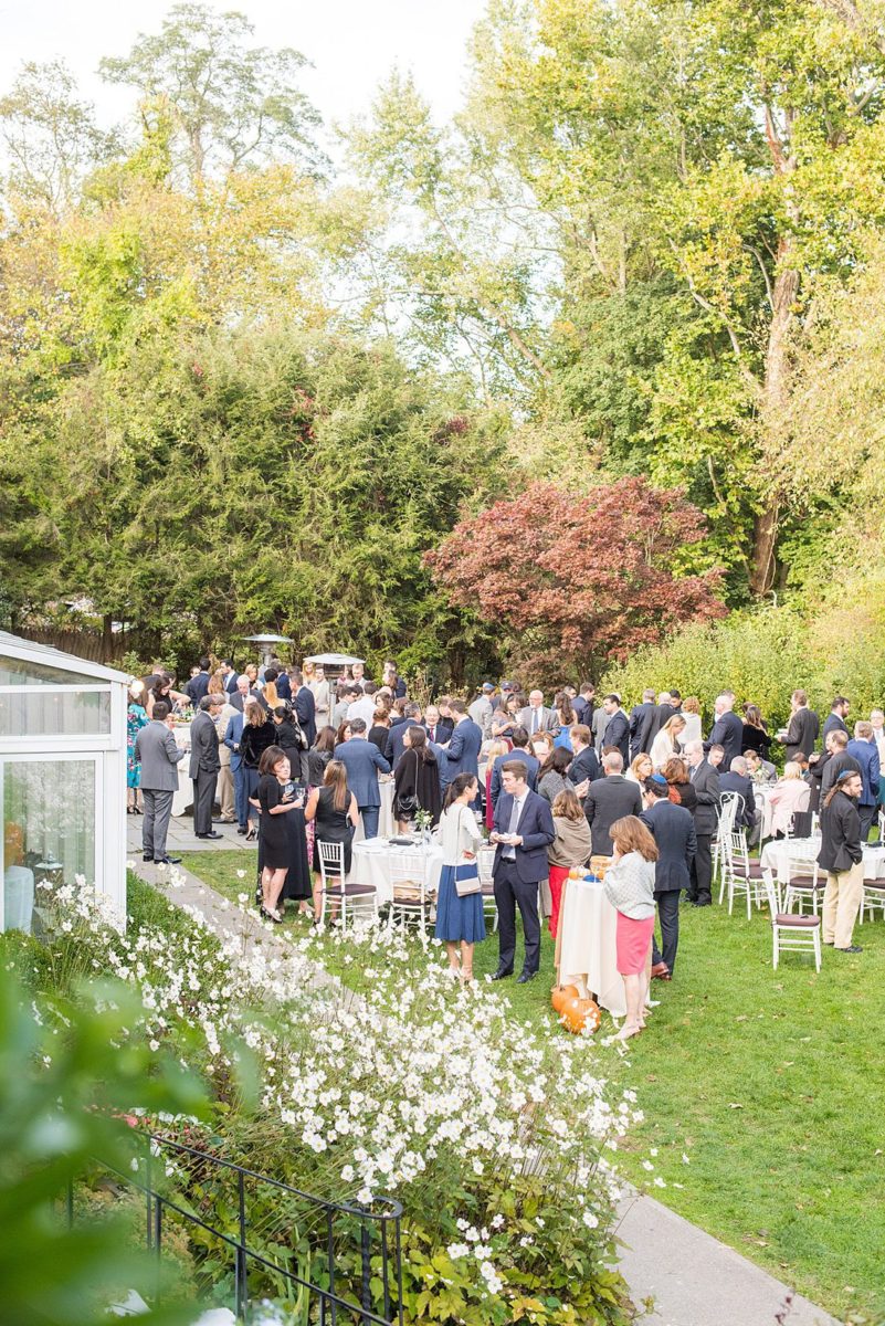 A fall wedding in upstate New York, just outside NYC, in Chappaqua, Westchester County. Photos taken by Mikkel Paige Photography at Crabtree's Kittle House. Ceremony outside and reception indoors, filled with custom carved pumpkins, autumn leaves, orange, white, and peach colors, berries, pears, pomegranates and sunflowers. #mikkelpaige #fallwedding #newyorkweddingvenues #nycweddingphotographer #outdoorceremony #autumnwedding #fallharvest