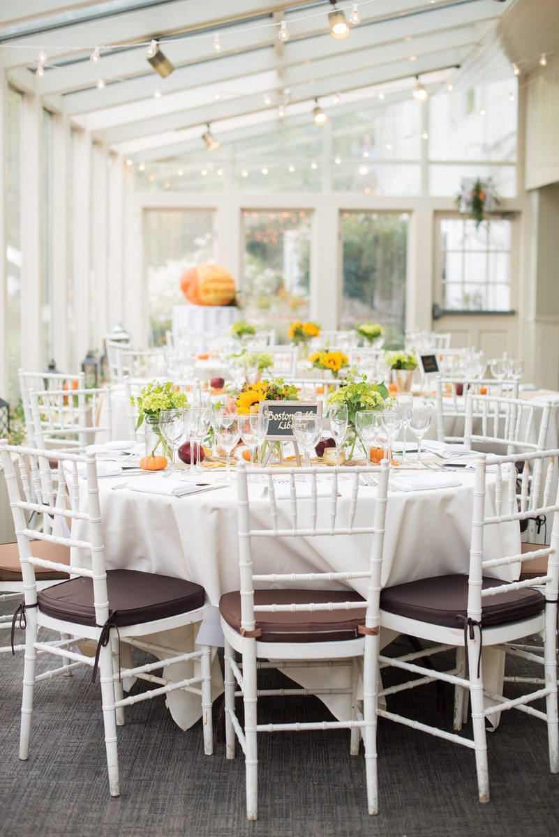 A fall wedding in upstate New York, just outside NYC, in Chappaqua, Westchester County. Photos taken by Mikkel Paige Photography at Crabtree's Kittle House. Ceremony outside and reception indoors, filled with custom carved pumpkins, autumn leaves, orange, white, and peach colors, berries, pears, pomegranates and sunflowers. #mikkelpaige #fallwedding #newyorkweddingvenues #nycweddingphotographer #outdoorceremony #autumnwedding #fallharvest