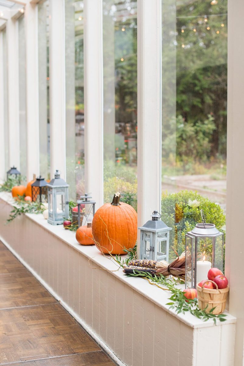 A fall wedding in upstate New York, just outside NYC, in Chappaqua, Westchester County. Photos taken by Mikkel Paige Photography at Crabtree's Kittle House. Ceremony outside and reception indoors, filled with custom carved pumpkins, autumn leaves, orange, white, and peach colors, berries, pears, pomegranates and sunflowers. #mikkelpaige #fallwedding #newyorkweddingvenues #nycweddingphotographer #outdoorceremony #autumnwedding #fallharvest