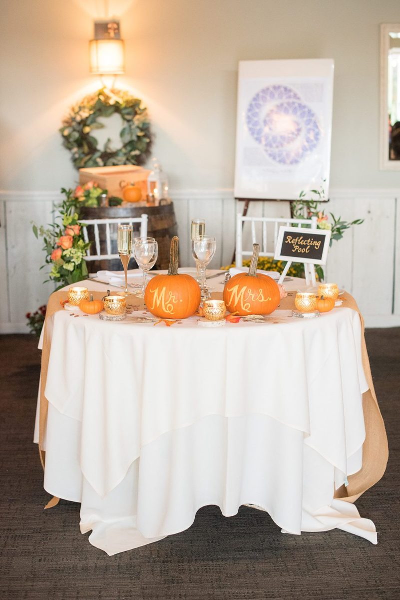 A fall wedding in upstate New York, just outside NYC, in Chappaqua, Westchester County. Photos taken by Mikkel Paige Photography at Crabtree's Kittle House. Ceremony outside and reception indoors, filled with custom carved pumpkins, autumn leaves, orange, white, and peach colors, berries, pears, pomegranates and sunflowers. #mikkelpaige #fallwedding #newyorkweddingvenues #nycweddingphotographer #outdoorceremony #autumnwedding #mrsandmrs #mrsandmrspumpkins