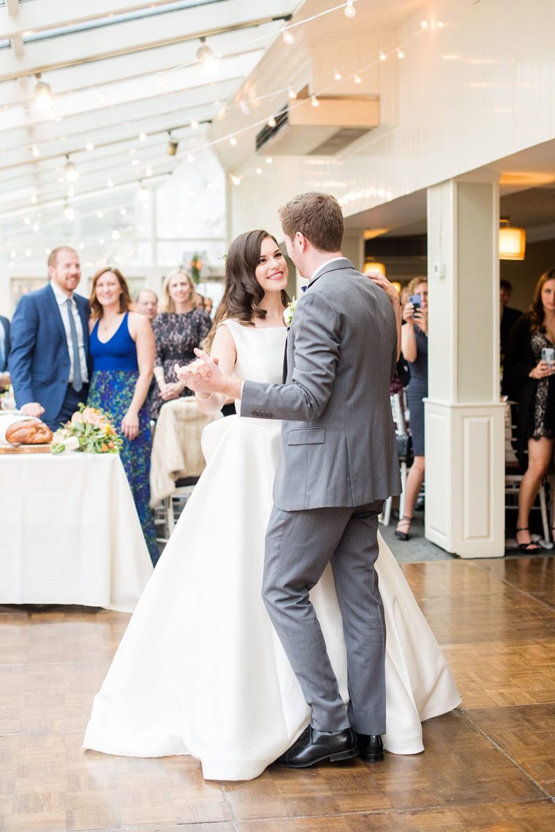 A fall wedding in upstate New York, just outside NYC, in Chappaqua, Westchester County. Photos taken by Mikkel Paige Photography at Crabtree's Kittle House. Ceremony outside and reception indoors filled with custom carved pumpkins, autumn leaves, orange, white, and peach colors, berries, pears, pomegranates and sunflowers. #mikkelpaige #fallwedding #newyorkweddingvenues #nycweddingphotographer #outdoorceremony #autumnwedding #mrsandmrs #weddingreception