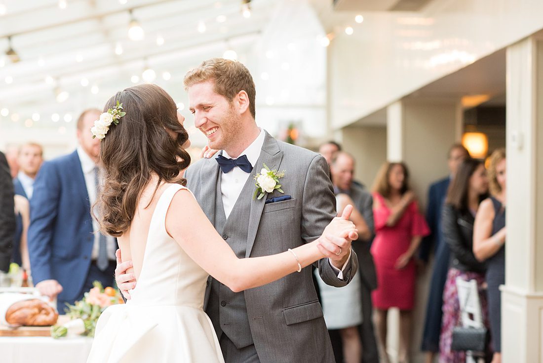 A fall wedding in upstate New York, just outside NYC, in Chappaqua, Westchester County. Photos taken by Mikkel Paige Photography at Crabtree's Kittle House. Ceremony outside and reception indoors filled with custom carved pumpkins, autumn leaves, orange, white, and peach colors, berries, pears, pomegranates and sunflowers. #mikkelpaige #fallwedding #newyorkweddingvenues #nycweddingphotographer #outdoorceremony #autumnwedding #mrsandmrs #weddingreception