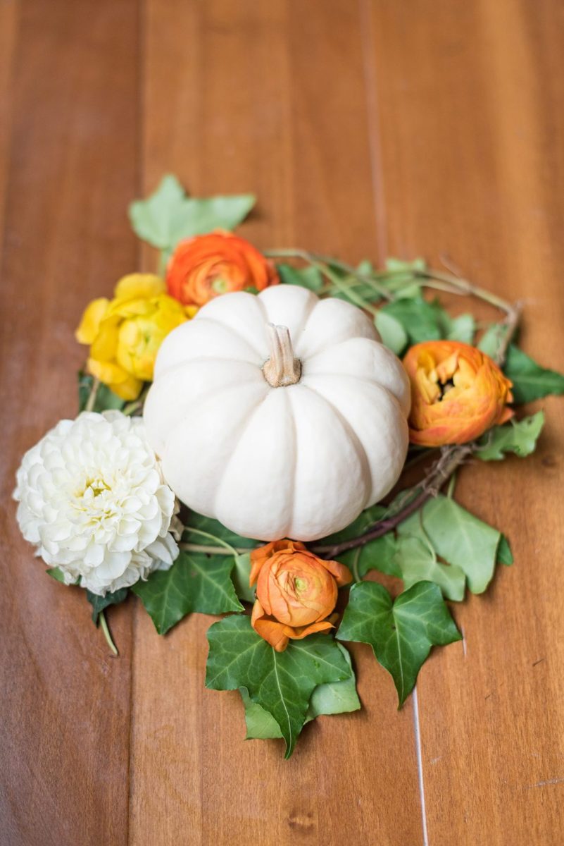 A fall wedding in upstate New York, just outside NYC, in Chappaqua, Westchester County. Photos taken by Mikkel Paige Photography at Crabtree's Kittle House. Ceremony outside and reception indoors, filled with custom carved pumpkins, autumn leaves, orange, white, and peach colors, berries, pears, pomegranates and sunflowers. #mikkelpaige #fallwedding #newyorkweddingvenues #nycweddingphotographer #outdoorceremony #autumnwedding #fallharvest