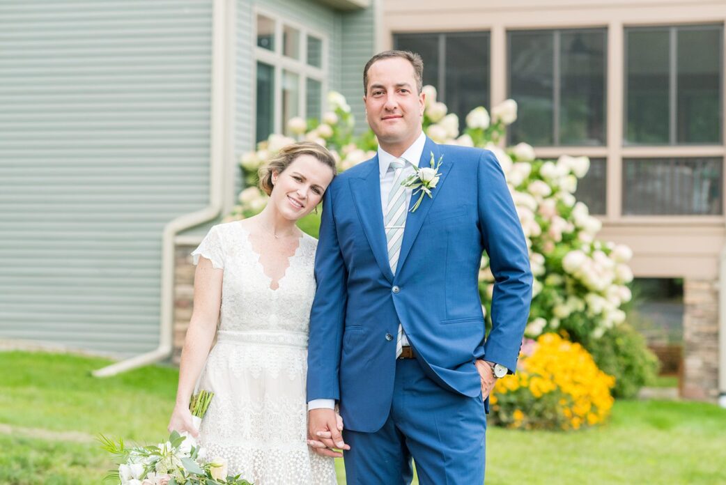 Saratoga Springs destination wedding photos in upstate New York by Mikkel Paige Photography, NY wedding photographer. The bride wore a boho lace gown and groom a blue suit with custom lining for an intimate wedding at a home. #mikkelpaige #saratogaspringswedding #destinationwedding #bridestyle #brideandgroom #groomstyle #customsuit #bohobride