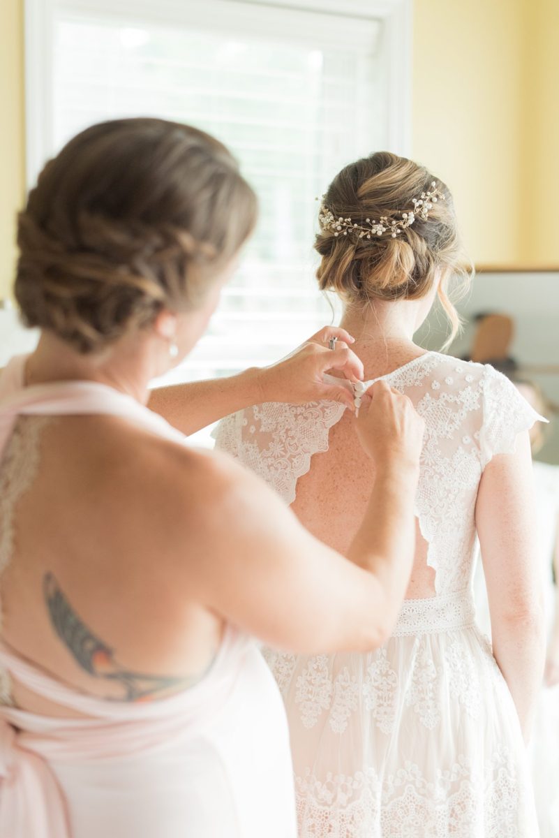 Saratoga Springs destination wedding photos in upstate New York by Mikkel Paige Photography, NY wedding photographer. The bride wore a boho lace gown an intimate wedding at a home and her sister and Maid of Honor helped her get ready for her day. #mikkelpaige #saratogaspringswedding #destinationwedding #bridestyle #bohobride #maidofhonor