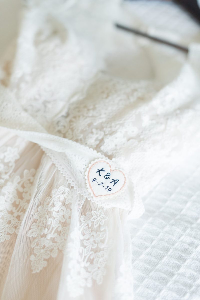 Detail picture of the custom date sewn into the bride's wedding gown. Her Saratoga Springs destination wedding photos in upstate New York are by Mikkel Paige Photography, NY wedding photographer. #mikkelpaige #saratogaspringswedding #destinationwedding #bridestyle #weddingdetails