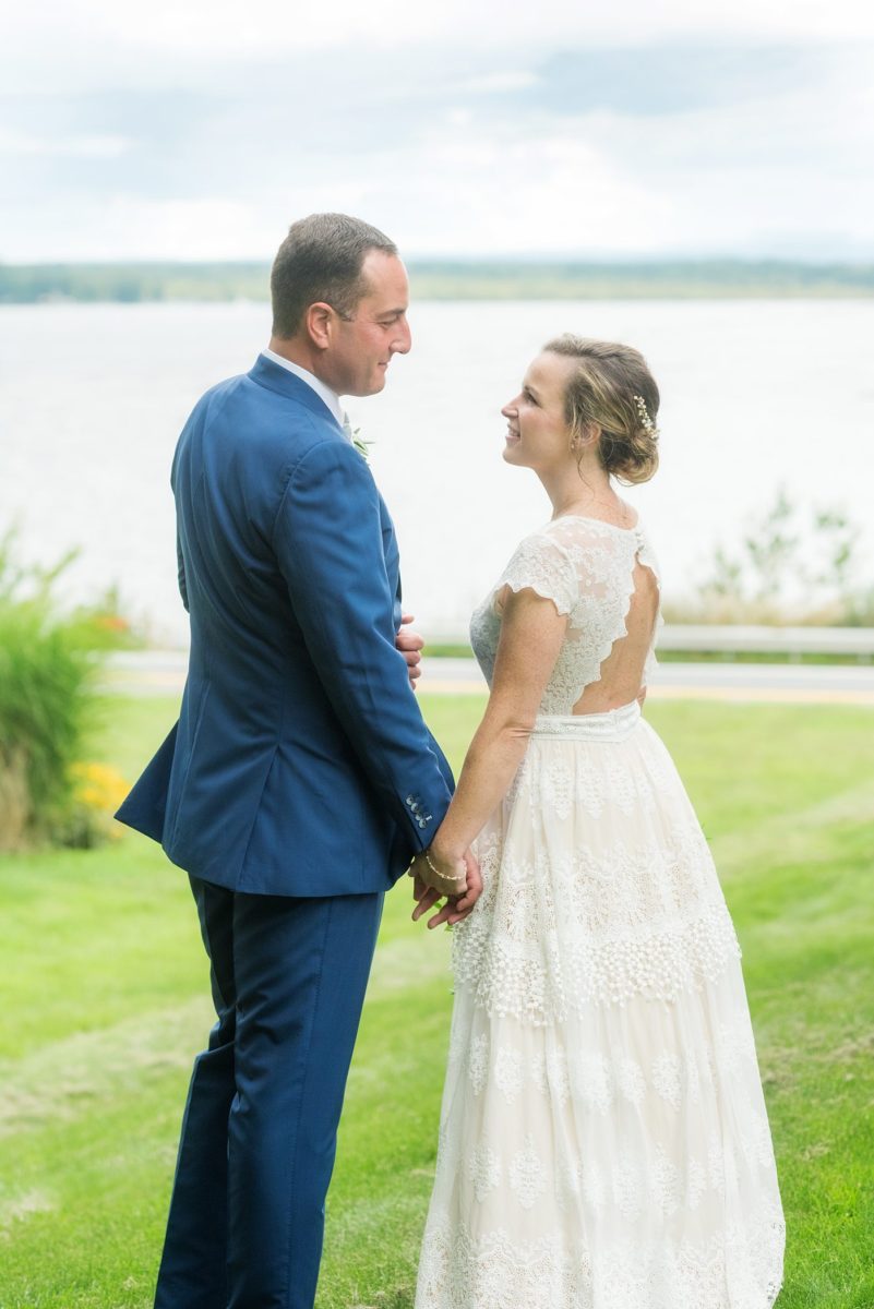 Saratoga Springs destination wedding photos in upstate New York by Mikkel Paige Photography, NY wedding photographer. The bride wore a boho lace gown and groom a blue suit with custom lining for an intimate wedding at a home. #mikkelpaige #saratogaspringswedding #destinationwedding #bridestyle #brideandgroom #groomstyle #customsuit #bohobride