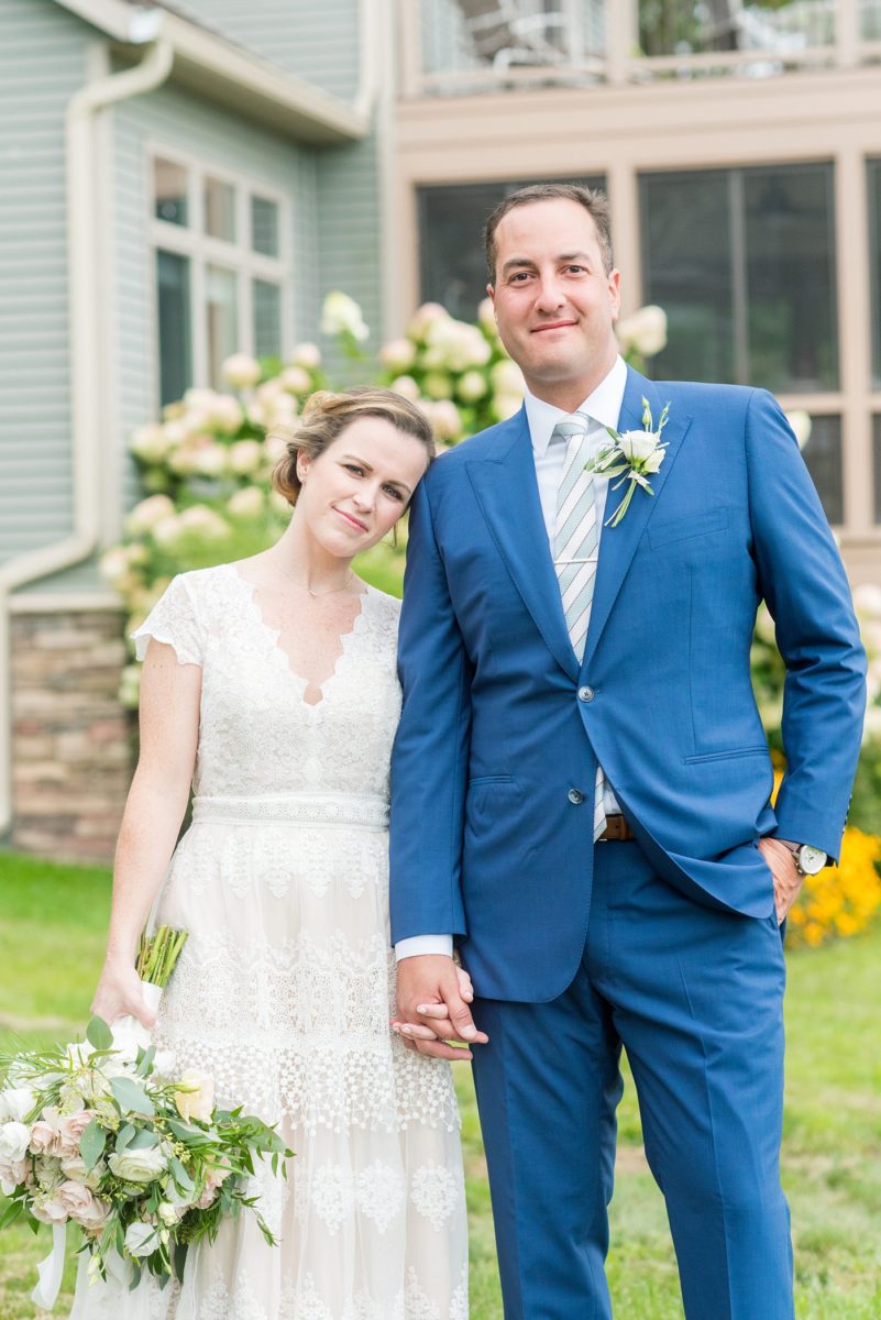 Saratoga Springs destination wedding photos in upstate New York by Mikkel Paige Photography, NY wedding photographer. The bride wore a boho lace gown and groom a blue suit with custom lining for an intimate wedding at a home. #mikkelpaige #saratogaspringswedding #destinationwedding #bridestyle #brideandgroom #groomstyle #customsuit #bohobride