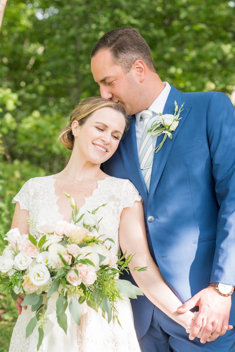 Saratoga Springs destination wedding photos in upstate New York by Mikkel Paige Photography, NY wedding photographer. The bride wore a boho lace gown and groom a blue suit with custom lining for an intimate wedding at a home. #mikkelpaige #saratogaspringswedding #destinationwedding #bridestyle #brideandgroom #groomstyle #customsuit #bohobride