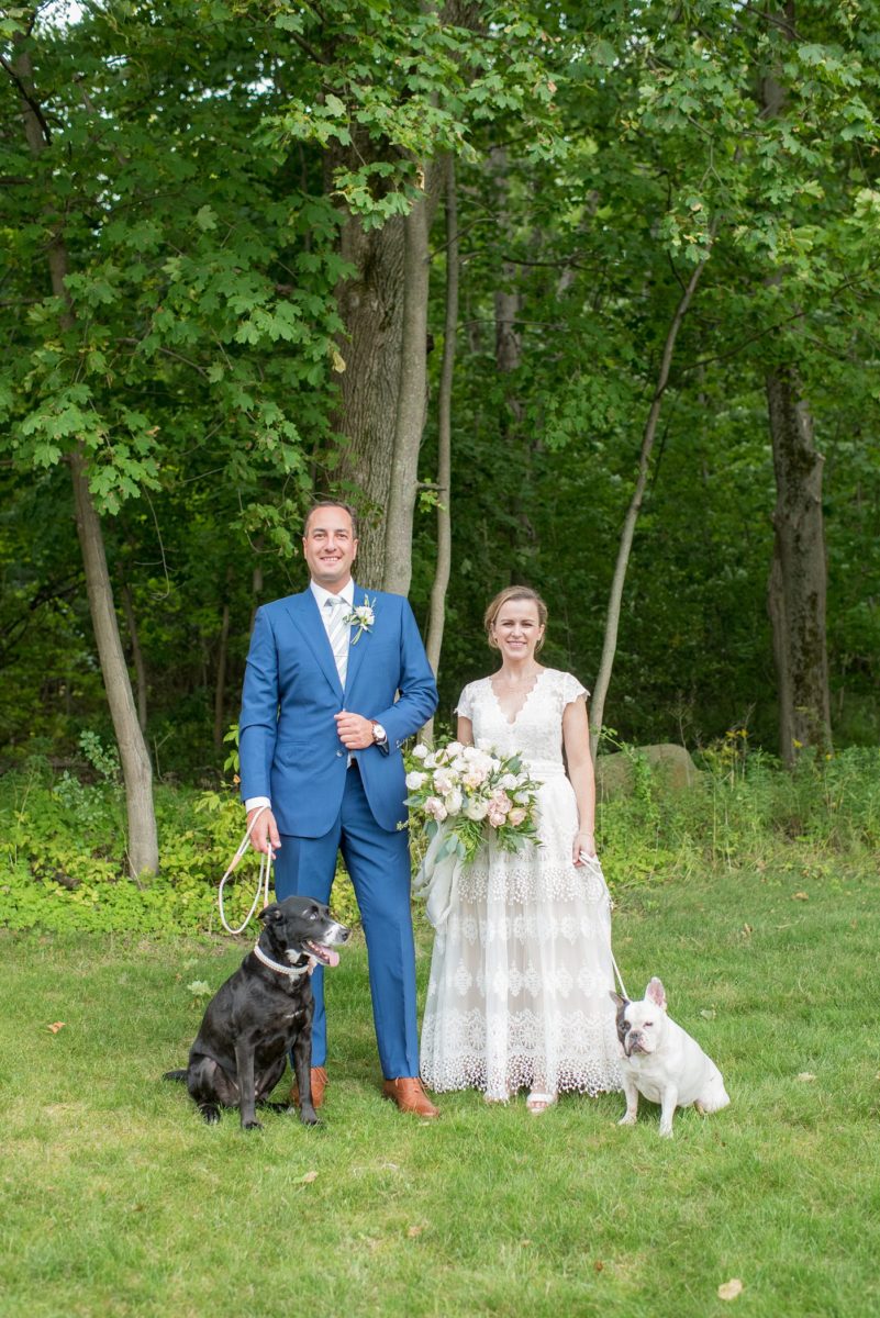 Saratoga Springs destination wedding photos in upstate New York by Mikkel Paige Photography, NY wedding photographer. The bride wore a boho lace gown and groom a blue suit with custom lining for an intimate wedding at a home. They had their dogs by their side as part of the family! #mikkelpaige #saratogaspringswedding #destinationwedding #bridestyle #brideandgroom #groomstyle #customsuit #bohobride #weddingdogs