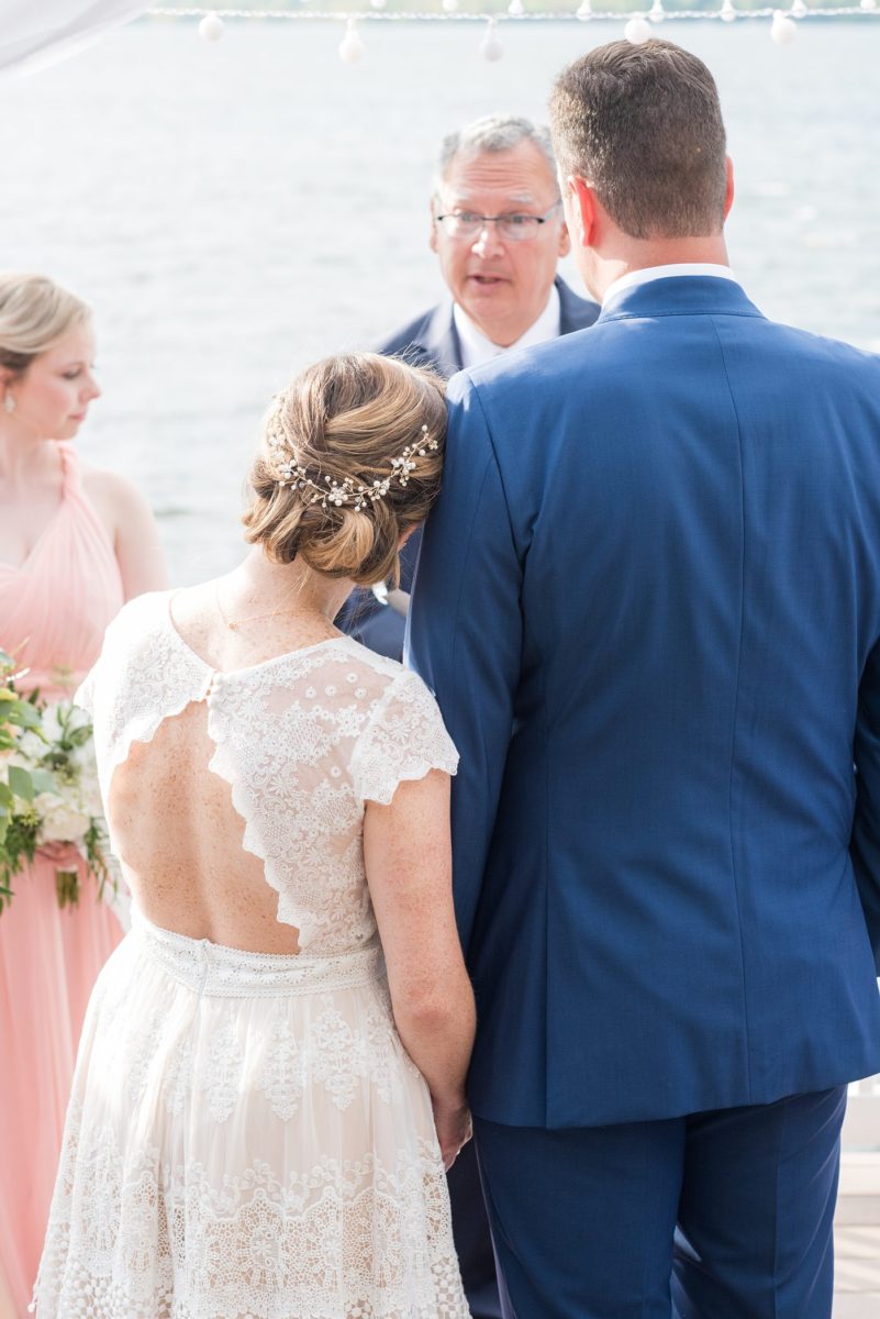 Saratoga Springs destination wedding photos in upstate New York by Mikkel Paige Photography, NY wedding photographer. The bride and groom were married in an intimate wedding at a home with a lakefront ceremony with Native American traditions. They had their dogs by their side as part of the ceremony! #mikkelpaige #saratogaspringswedding #destinationwedding #lakefrontwedding #waterfrontwedding #lakewedding