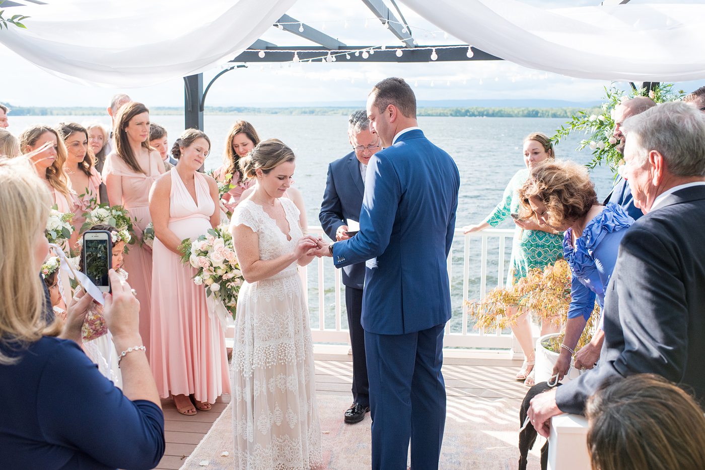 Saratoga Springs destination wedding photos in upstate New York by Mikkel Paige Photography, NY wedding photographer. The bride and groom were married in an intimate wedding at a home with a lakefront ceremony with Native American traditions. They had their dogs by their side as part of the ceremony! #mikkelpaige #saratogaspringswedding #destinationwedding #lakefrontwedding #waterfrontwedding #lakewedding