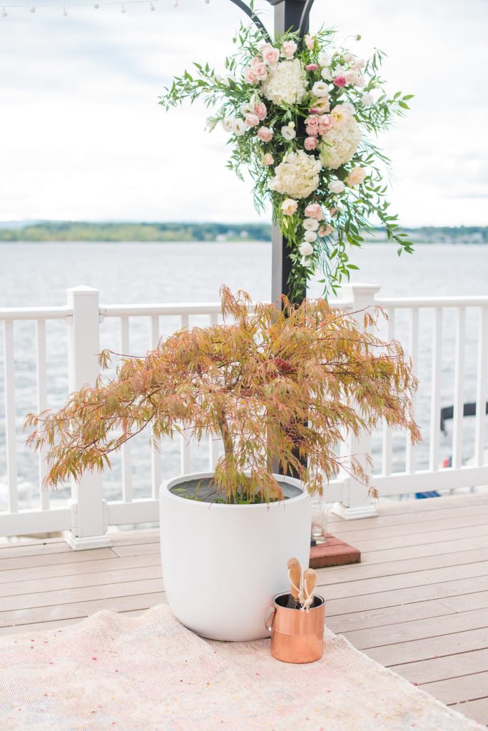Saratoga Springs destination wedding photos in upstate New York by Mikkel Paige Photography, NY wedding photographer. The bride and groom were married in an intimate wedding at a home with a lakefront ceremony with Native American traditions. They had their dogs by their side as part of the ceremony! #mikkelpaige #saratogaspringswedding #destinationwedding #lakefrontwedding #waterfrontwedding #lakewedding