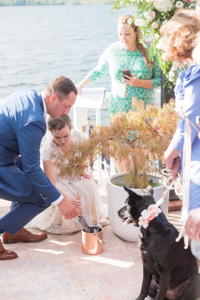 Saratoga Springs destination wedding photos in upstate New York by Mikkel Paige Photography, NY wedding photographer. The bride and groom were married in an intimate wedding at a home with a lakefront ceremony with Native American traditions. They had their dogs by their side as part of the ceremony! #mikkelpaige #saratogaspringswedding #destinationwedding #lakefrontwedding #waterfrontwedding #lakewedding