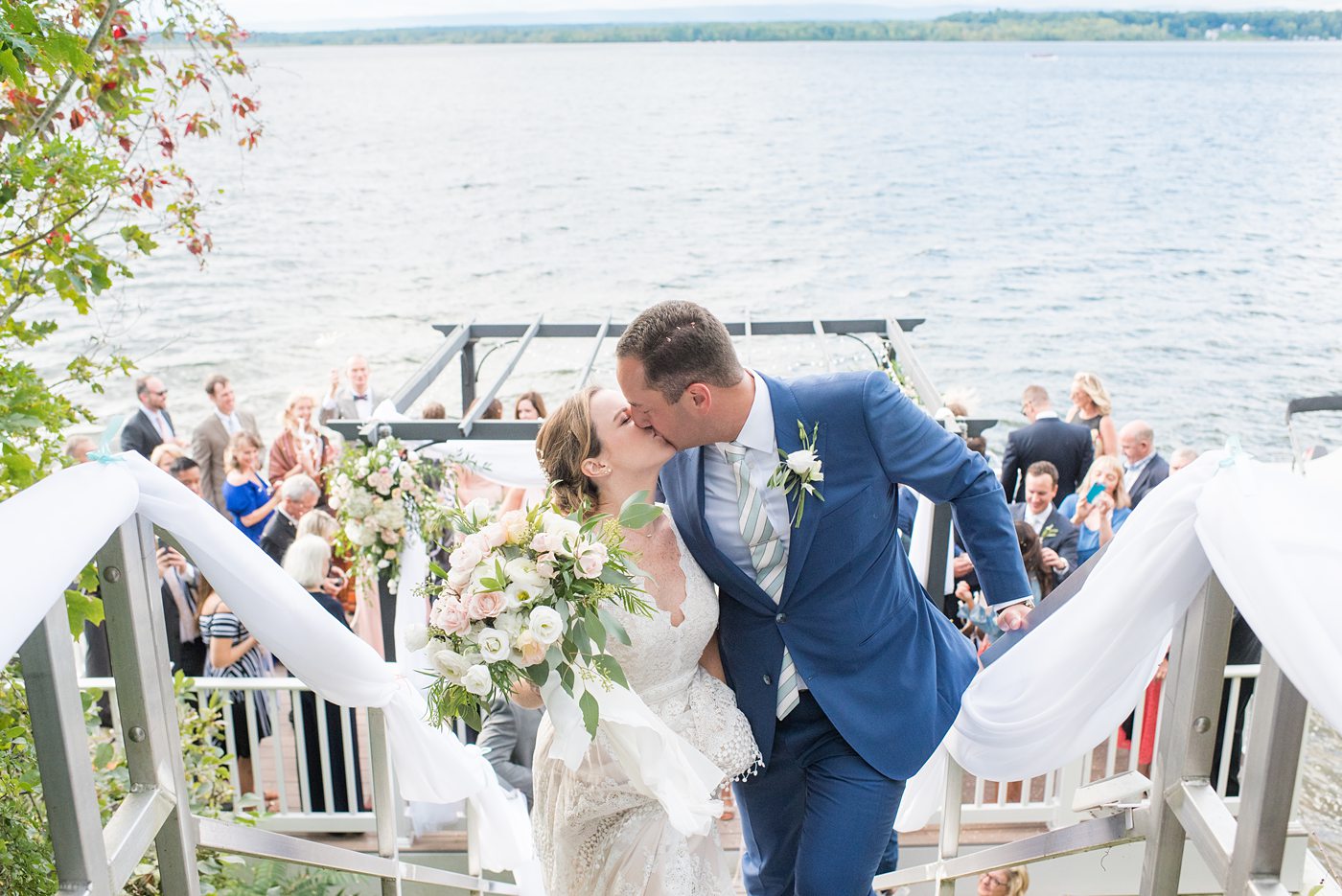 Saratoga Springs destination wedding photos in upstate New York by Mikkel Paige Photography, NY wedding photographer. The bride and groom were married in an intimate wedding at a home with a lakefront ceremony with Native American traditions. They had their dogs by their side as part of the ceremony! #mikkelpaige #saratogaspringswedding #destinationwedding #lakefrontwedding #waterfrontwedding #lakewedding