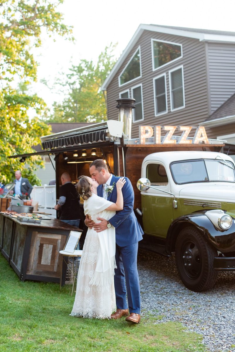 Saratoga Springs destination wedding photos in upstate New York by Mikkel Paige Photography, NY wedding photographer. The intimate wedding at a home had catering from a vintage pizza food truck. #mikkelpaige #saratogaspringswedding #destinationwedding #vintagetruck #pizzatruck #foodtruckwedding #foodtruck