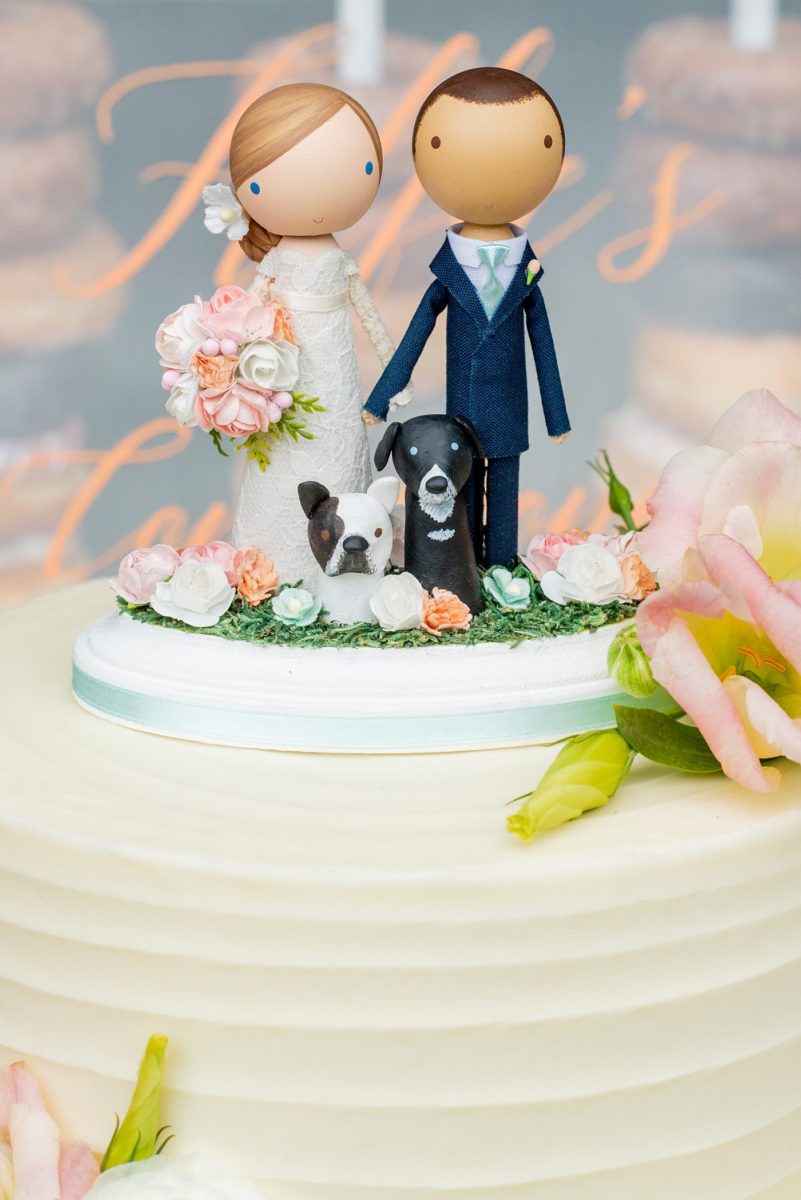 Saratoga Springs destination wedding photos in upstate New York by Mikkel Paige Photography, NY wedding photographer. The buttercream cake had a wooden people custom cake topper from Etsy for the bride, groom and their two dogs. #mikkelpaige #saratogaspringswedding #destinationwedding #customcaketopper #weddingdogs