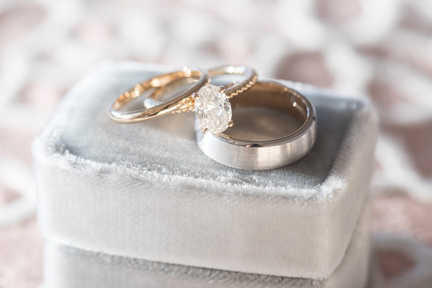 Chatham Station wedding photos my Mikkel Paige Photography from this urban chic beautiful venue in Cary, North Carolina. Detail picture of the gold and diamond wedding rings and bands on a blue velvet box. #mikkelpaige #RaleighWeddingphotographer #chathamstation #CaryNC #weddingvenues #velvetringbox #weddingrings