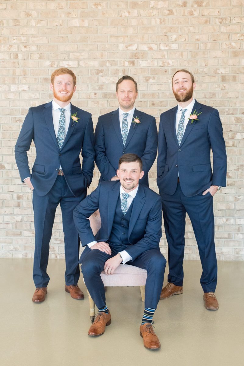 Chatham Station wedding photos my Mikkel Paige Photography from this urban chic beautiful venue in Cary, North Carolina. Picture of the groom and groomsmen in navy suits. #mikkelpaige #RaleighWeddingphotographer #chathamstation #CaryNC #weddingvenues #groomstyle #groomsmen