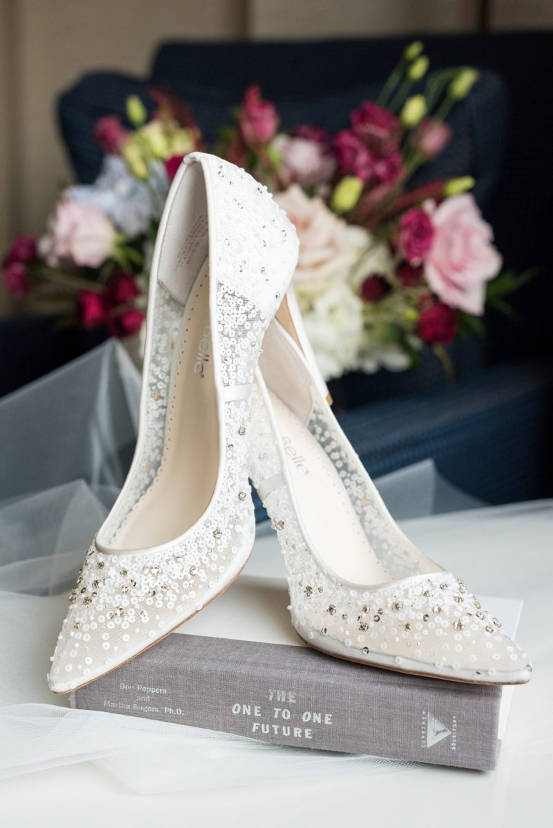 Detail photo of a bride's white dot and rhinestone heels with mesh detail for a wedding at Duke Chapel, in Durham North Carolina, by Mikkel Paige Photography. #mikkelpaige #dukechapel #DukeWedding #durhamweddingphotographer #weddingshoes #novemberwedding #bridestyle #weddingshoes