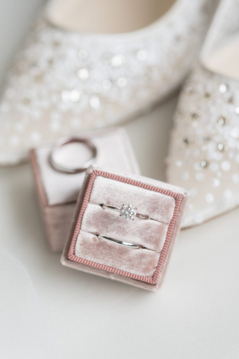 Detail photo of a bride's white gold rings in a pink velvet Mrs. Box for a wedding at Duke Chapel, in Durham North Carolina, by Mikkel Paige Photography. #mikkelpaige #dukechapel #DukeWedding #durhamweddingphotographer #ringshots #velvetringbox #mrsbox #novemberwedding #bridestyle #weddingrings