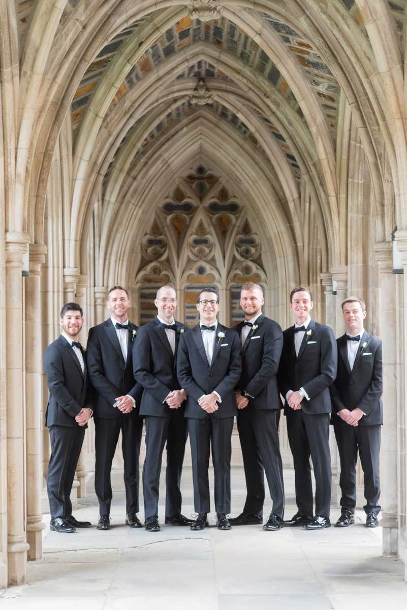 Groomsmen photo with the groom in a classic black tuxedo for a wedding at Duke Chapel, in Durham North Carolina, by Mikkel Paige Photography. #mikkelpaige #dukechapel #DukeWedding #durhamweddingphotographer #novemberwedding #groomstyle #groomsmen