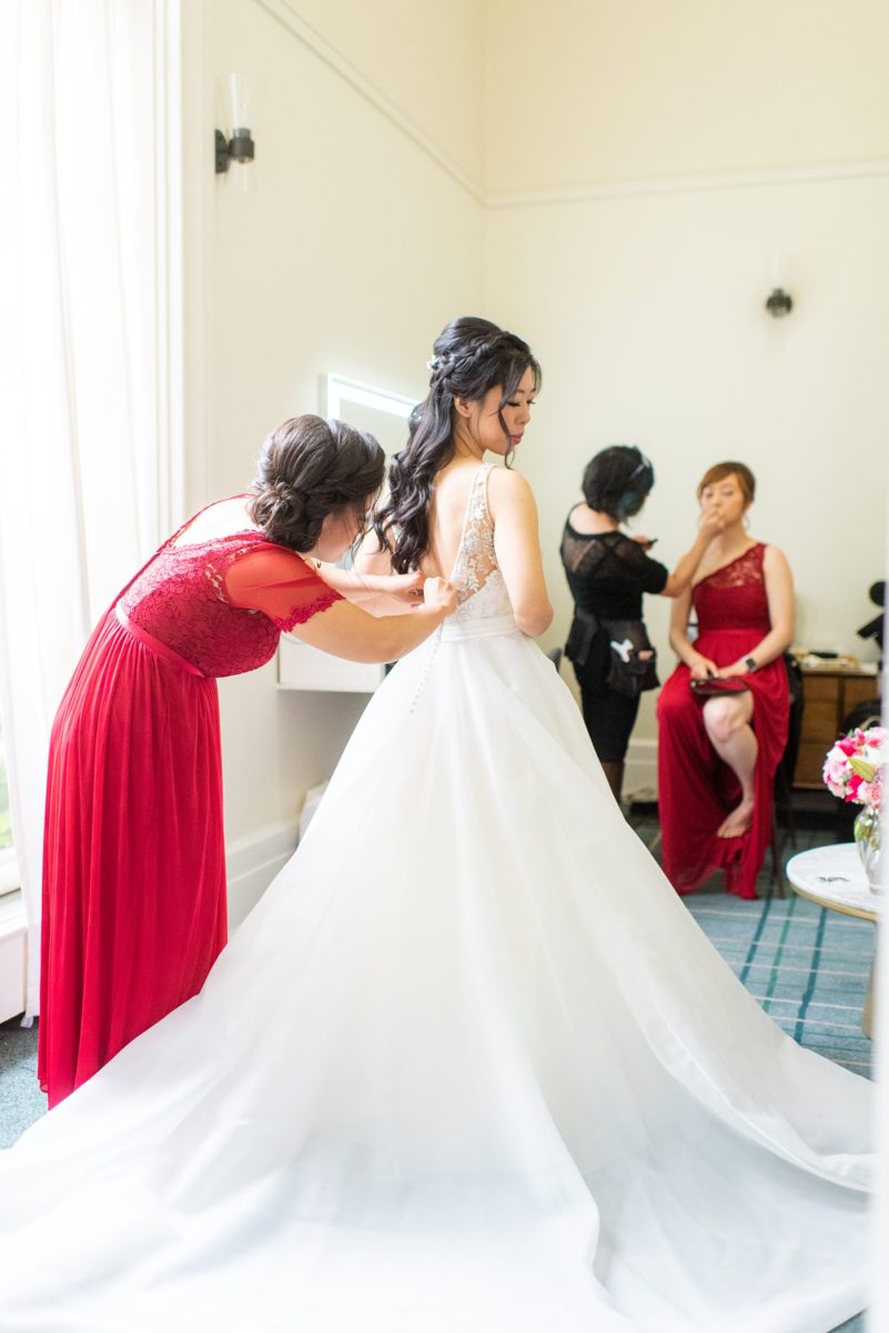 New York Botanical Garden wedding photos by Mikkel Paige Photography. After the couple's engagement photoshoot in Manhattan I was so excited for their fall wedding near the Conservatory at the Terrace Room, at this NYC venue. The bride wore a beaded ballgown dress. with half up braided hair do and big bow on her back before the train. #bridestyle #mikkelpaige #nybg #newyorkbotanicalgardenwedding #asianbride #NYBotanicalGarden #Bronxwedding