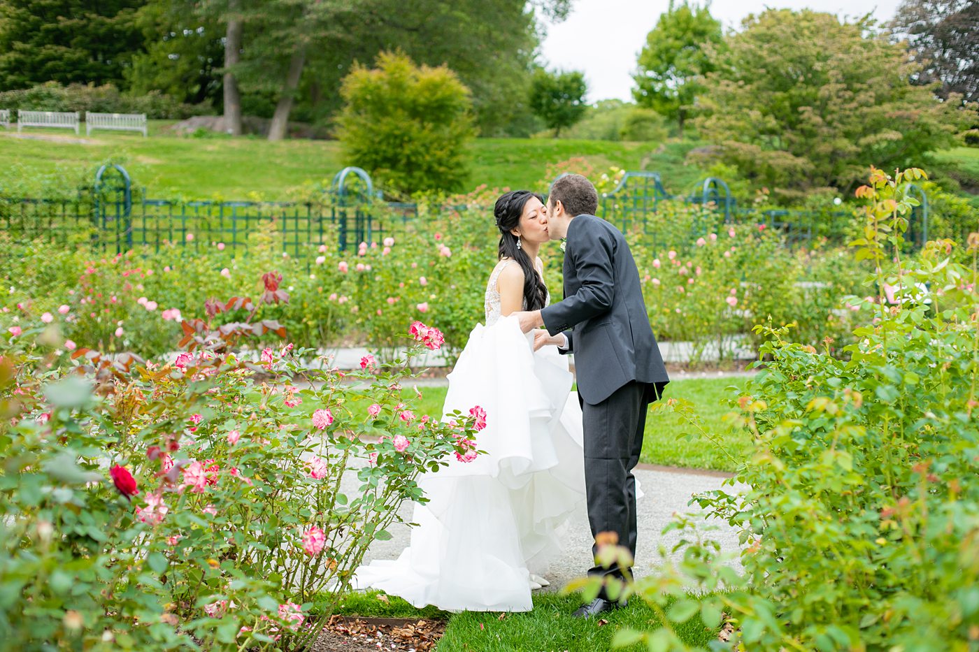 New York Botanical Garden wedding photos by Mikkel Paige Photography. The groom wore a green tie with floral detail and gray suit and bride a beaded ballgown with bow on the back. After the couple's engagement photoshoot in Manhattan I was so excited for their fall wedding near the Conservatory at the Terrace Room, at this NYC venue. #mikkelpaige #nybg #asianbride #bridestyle #brideandgroom #newyorkbotanicalgardenwedding #groomstyle #NYBotanicalGarden #Bronxwedding #newyorkcityweddingvenue